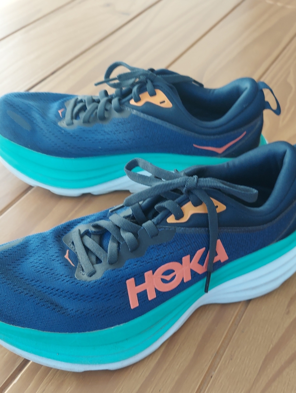 Hoka Bondi 8 Navy Blue Running Shoes with Teal Midsole and Coral Logo